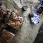 rolo brownies on parchment paper with rolo candies