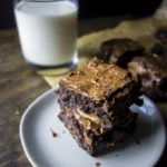 stack of rolo brownie on plate with glass of milk