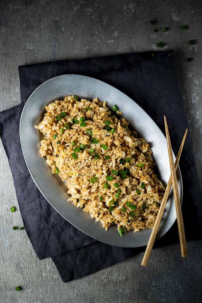 plate of fried rice with chopsticks
