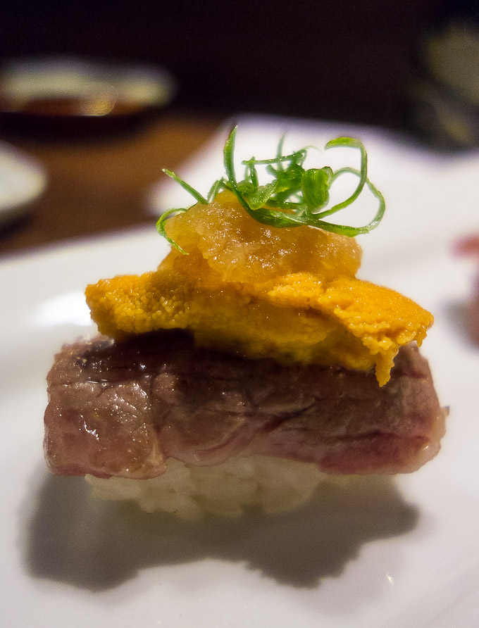best sushi in san diego, seared A5 wagyu beef sushi topped with uni and garnish
