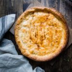 easy homemade crawfish pie in a pie plate made with roux and crawfish tail meat