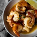 shrimp in a butter sauce in a bowl.