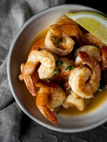 shrimp in a butter sauce in a bowl