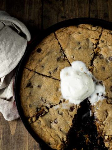 cookie cooked in a skillet topped with ice cream