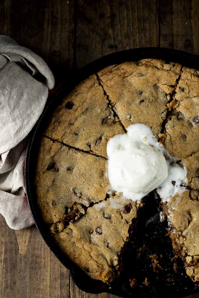 cookie cooked in a skillet topped with ice cream