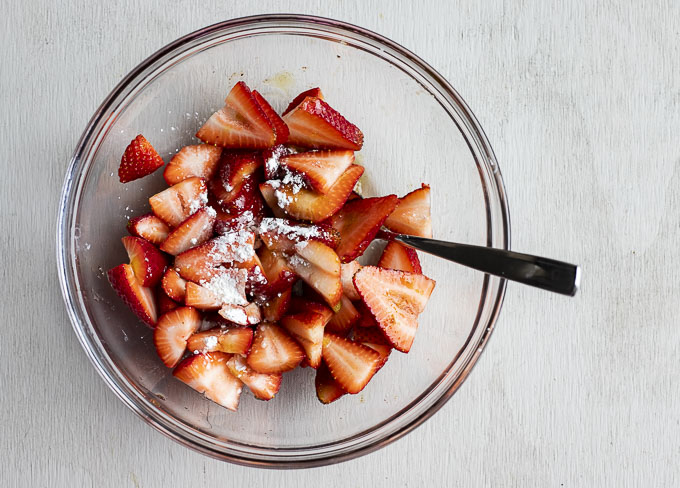strawberries in a bowl with sugar