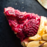 close up of slice of raspberry pie