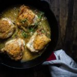 pan of white wine and mustard braised chicken thighs