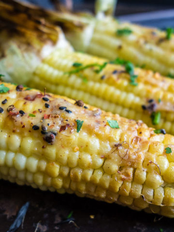close up of grilled corn with miso butter