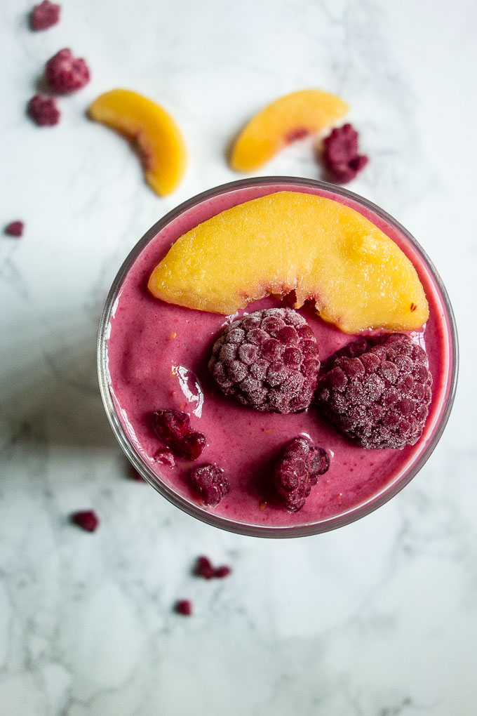 red smoothies with berries and peaches