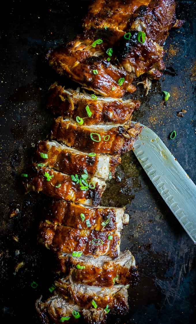 sliced ribs with sauce and green onions