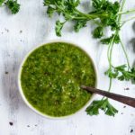 bowl of chimichurri sauce with a spoon