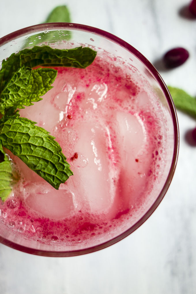 close up of cranberry lemonade with mint