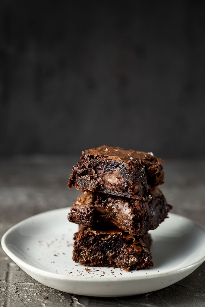 stack of 3 brownies on a plate