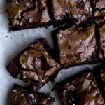 sliced brownies on parchment paper