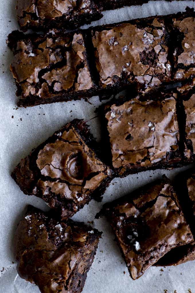 sliced brownies on parchment paper