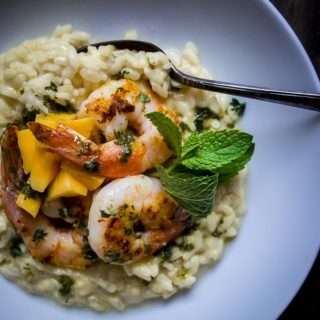 shrimp risotto with mango in a bowl with chimichurri sauce