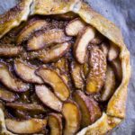 easy salted caramel apple galette on parchment paper