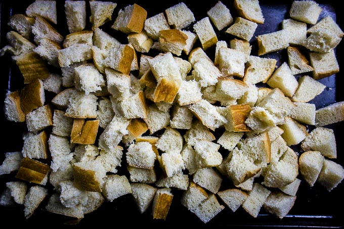 bread cubes on a baking tray