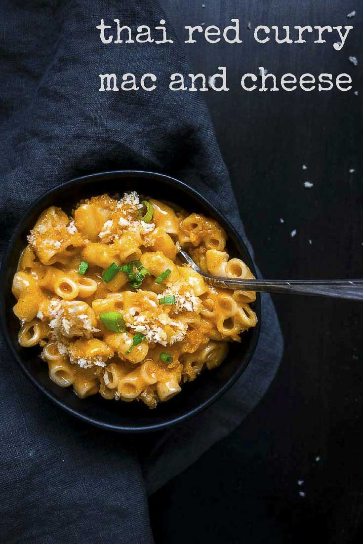 thia red curry mac and cheese in a bowl with green onions