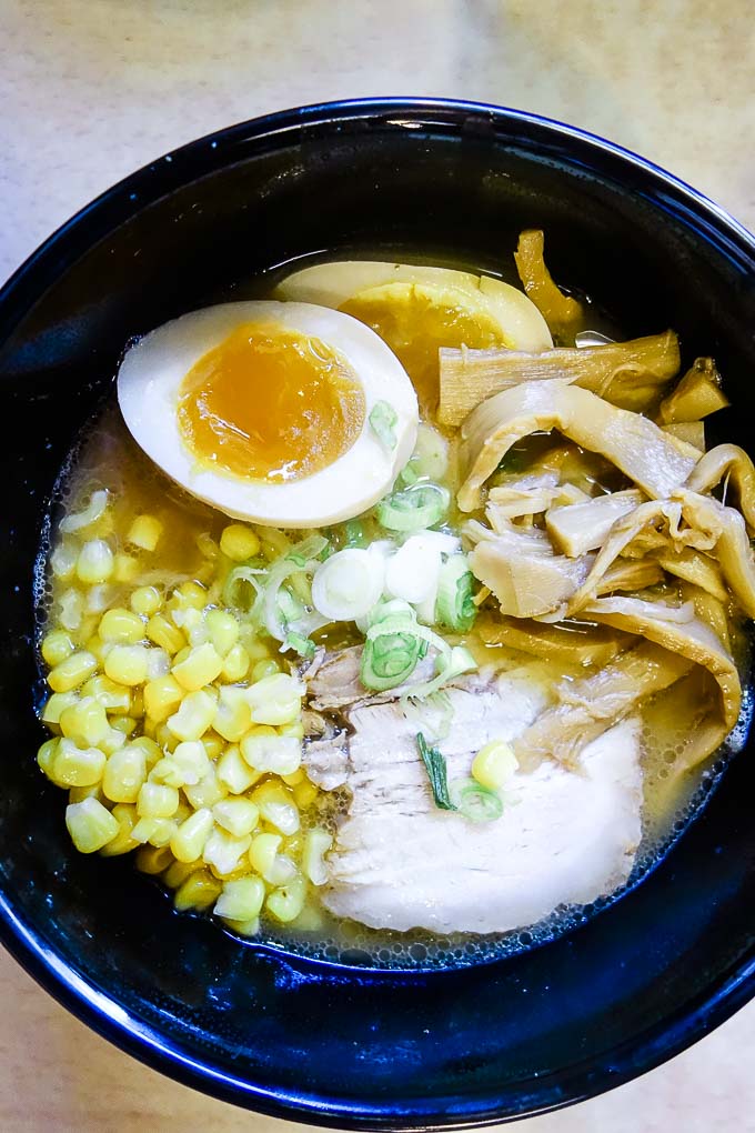 bowl of ramen with corn and an egg
