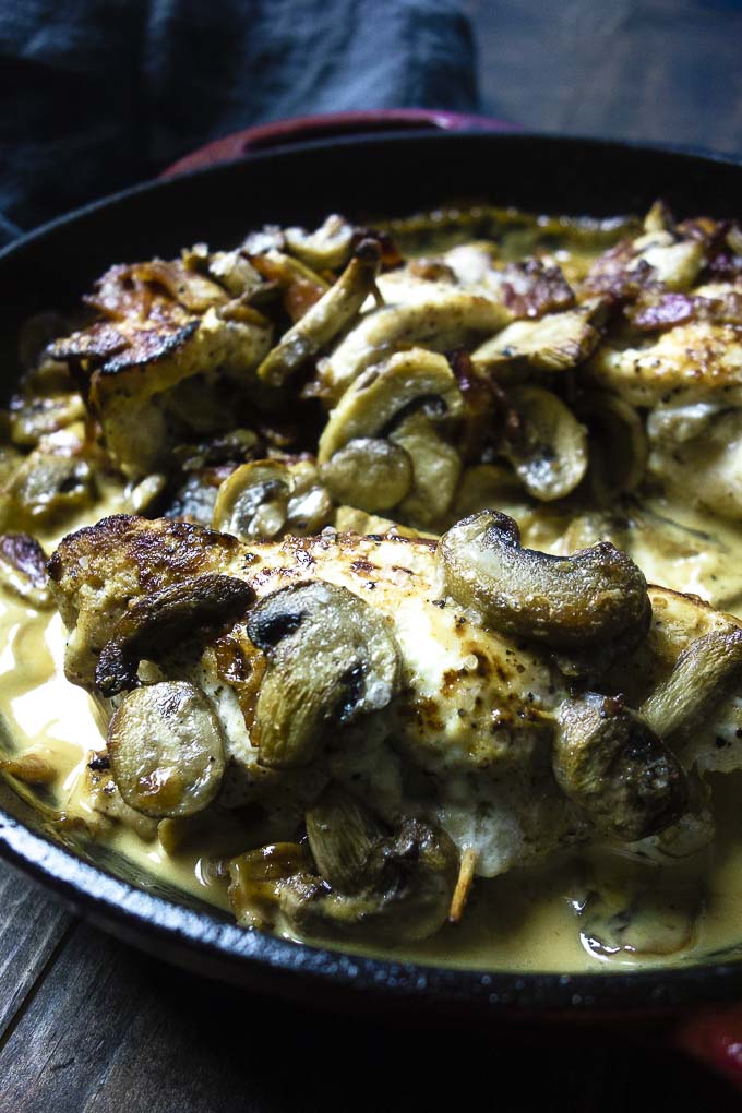 stuffed chicken breast recipe with mushrooms in a skillet