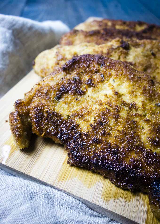 fried breaded pork chops on a serving platter