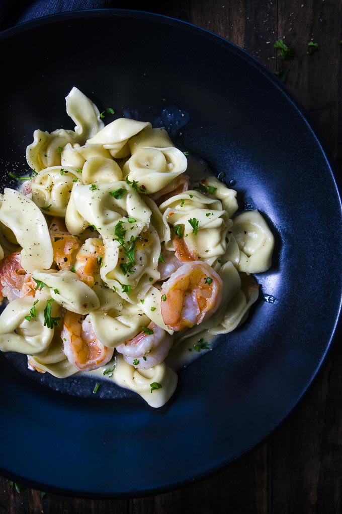 close up of tortellini with a creamy shrimp sauce in a bowl