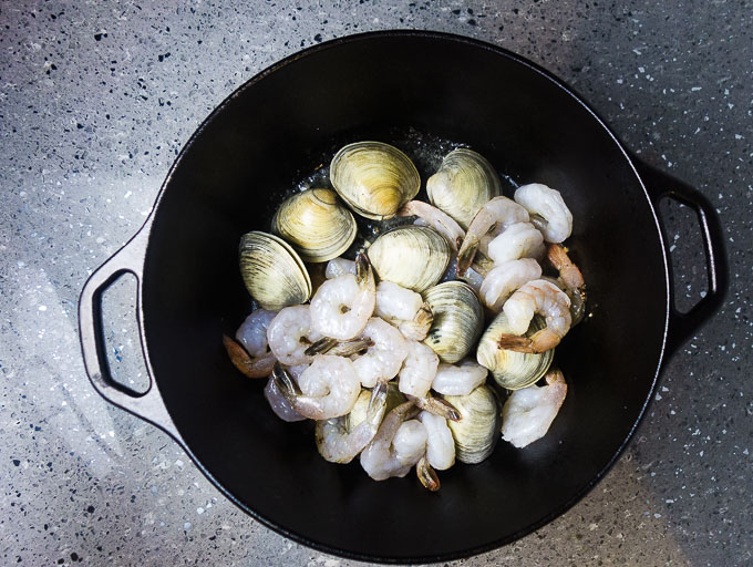 shrimp and clams in a dutch oven