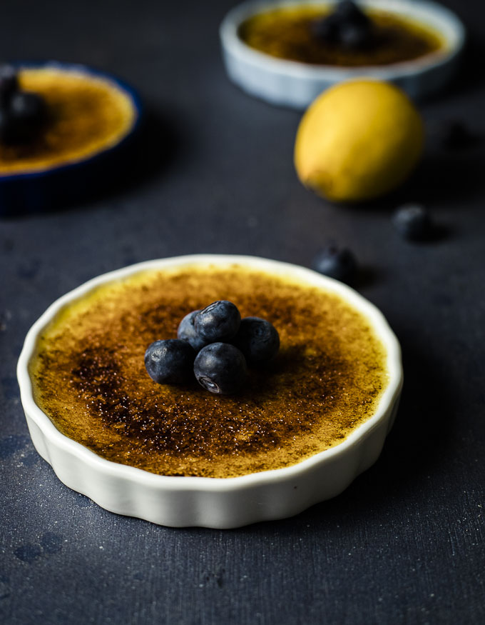 creme brulee with caramelized top and blueberries