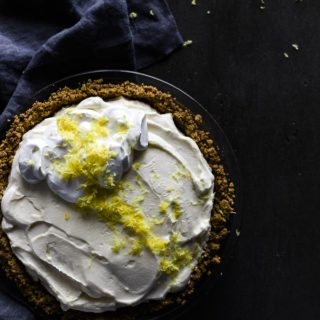 lemon pie with whipped cream and lemon zest on top