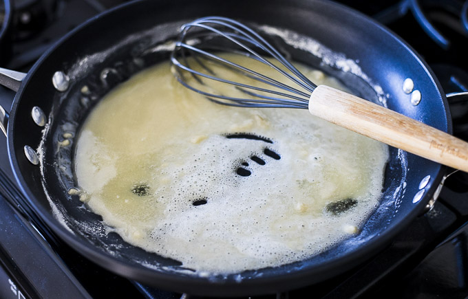 melted butter and flour in a skillet with a whisk