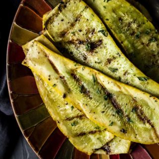 grilled squash on a colorful platter