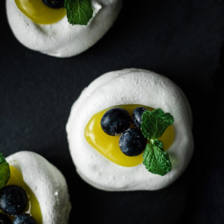 meringue cookies filled with lemon curd and blueberries