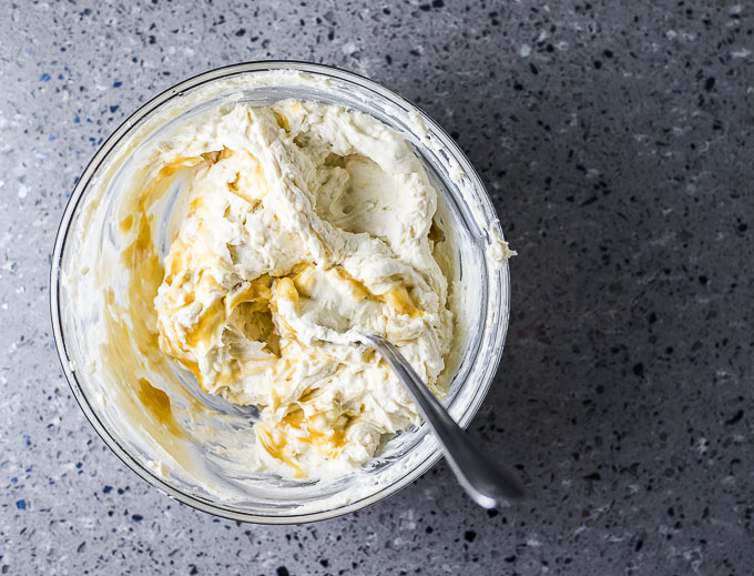 whipped mascarpone cheese in a glass bowl