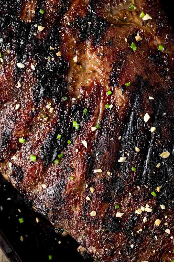 close up photo of grilled ribs garnished with chives