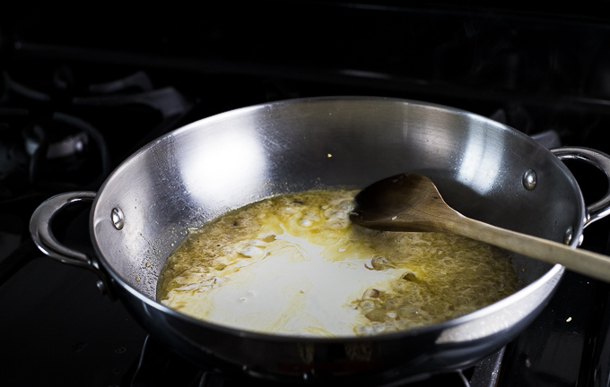 broth and cream in a saute pan to make a sauce