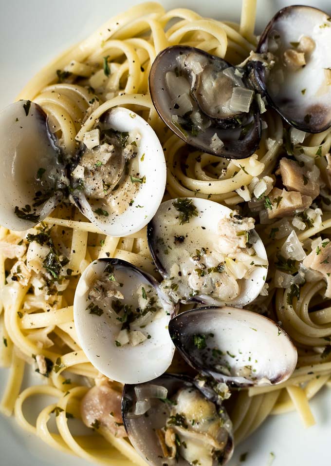 close up of fresh clams on linguine
