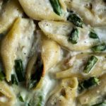 ricotta stuffed shells with asparagus in a creamy sauce
