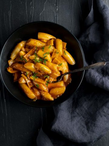 korean rice cakes in an orange sauce