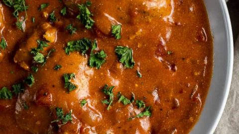 chicken in orange sauce with parsley on top