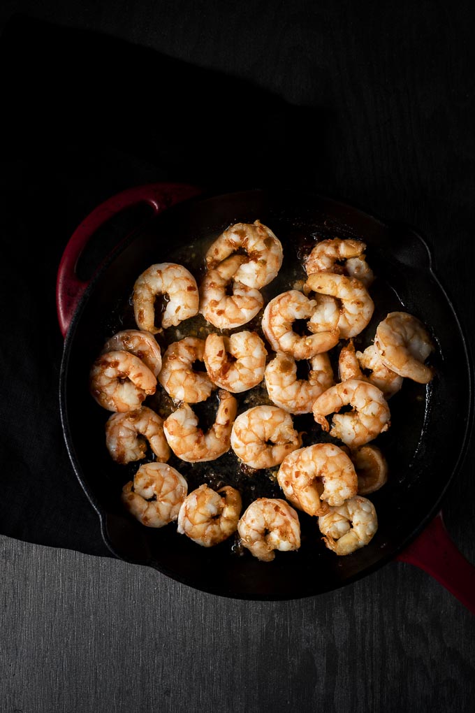 cooked shrimp in a cast iron skillet