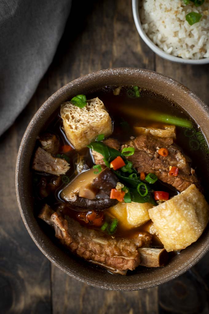 bowl of soup with ribs, mushrooms, tofu and chilies
