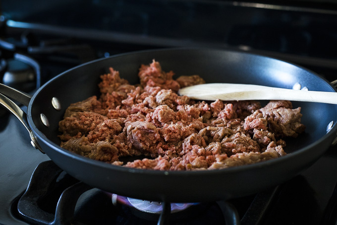 raw ground beef in a skillet