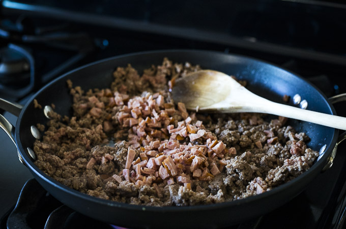 cooked ground beef and sausage in a skillet