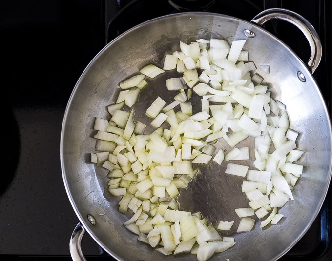 chopped onions in a saute pan