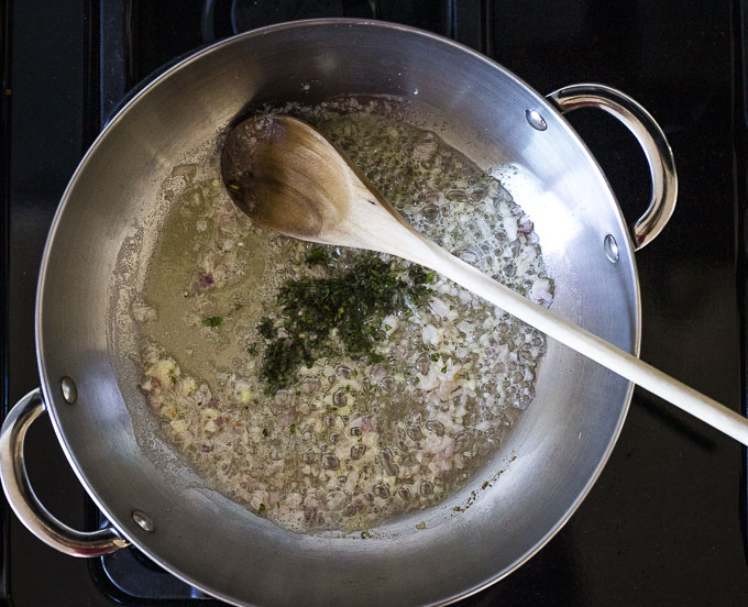 onions, liquid and herbs in a skillet