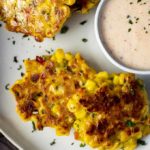 crispy corn fritters on a plate