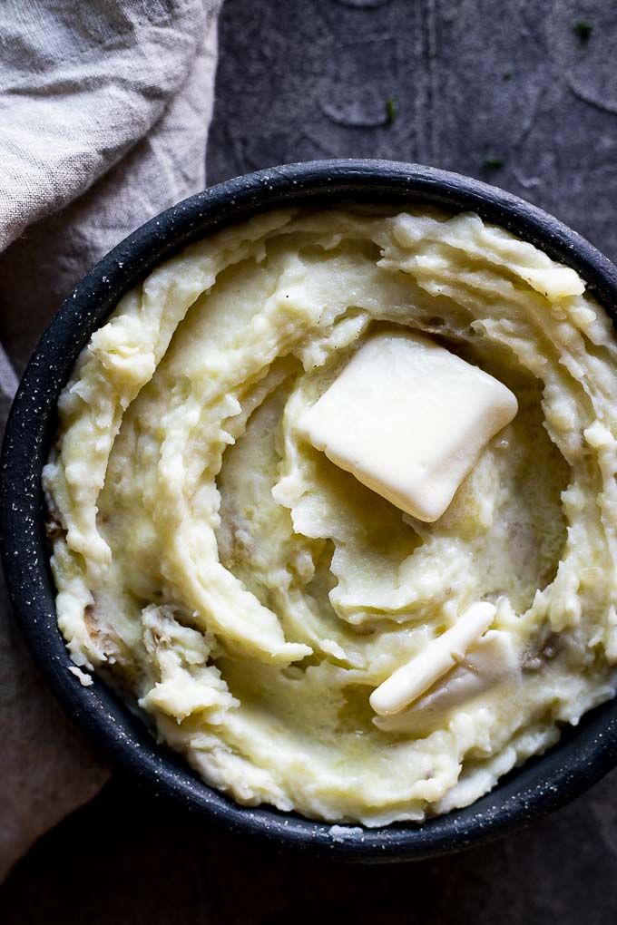 mashed potatoes in a bowl with butter