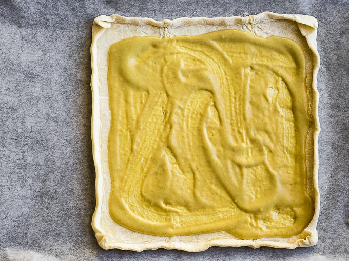 puff pastry with yellow sauce on top